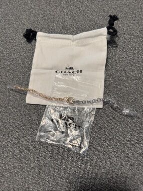 Gold and silver Coach bracelet